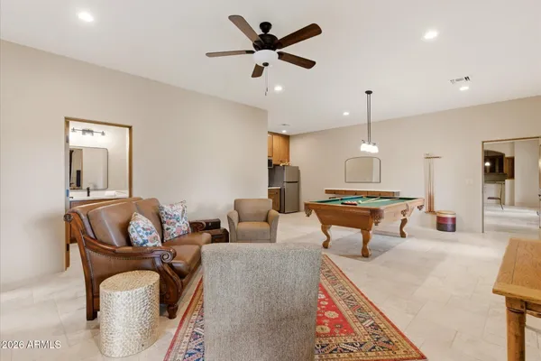a kitchen with stainless steel appliances granite countertop a sink and a refrigerator