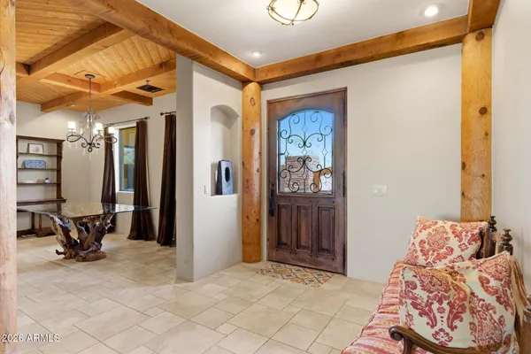 a view of a bedroom with furniture and a window