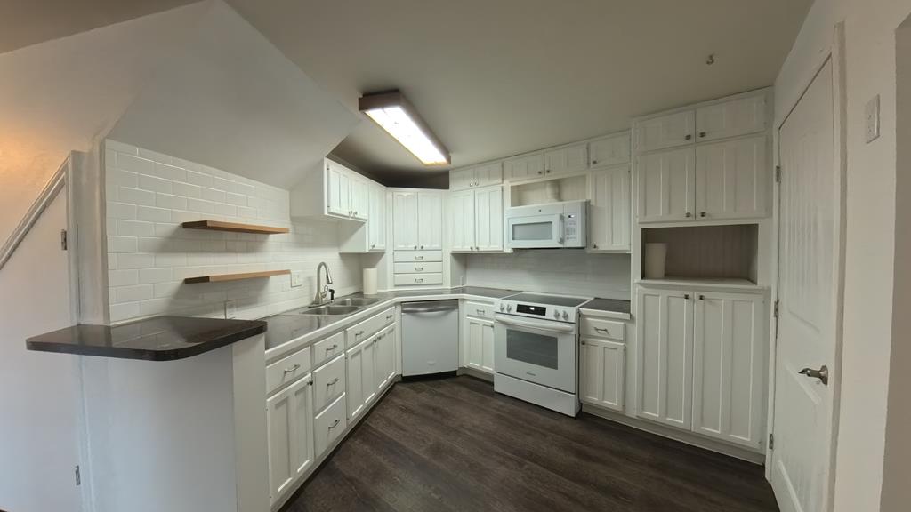 929 Red Bluff Road Pipe Creek, TX 78063 - Photo 4 of 29 a kitchen with stainless steel appliances granite countertop a stove and a refrigerator