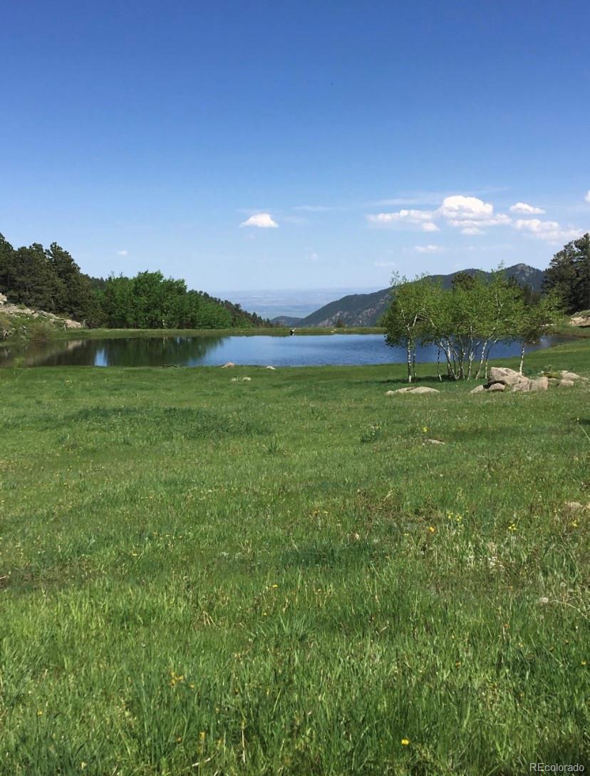 233 Ridge Road Ward, CO 80481 - Photo 36 of 36 a view of a green field with an ocean
