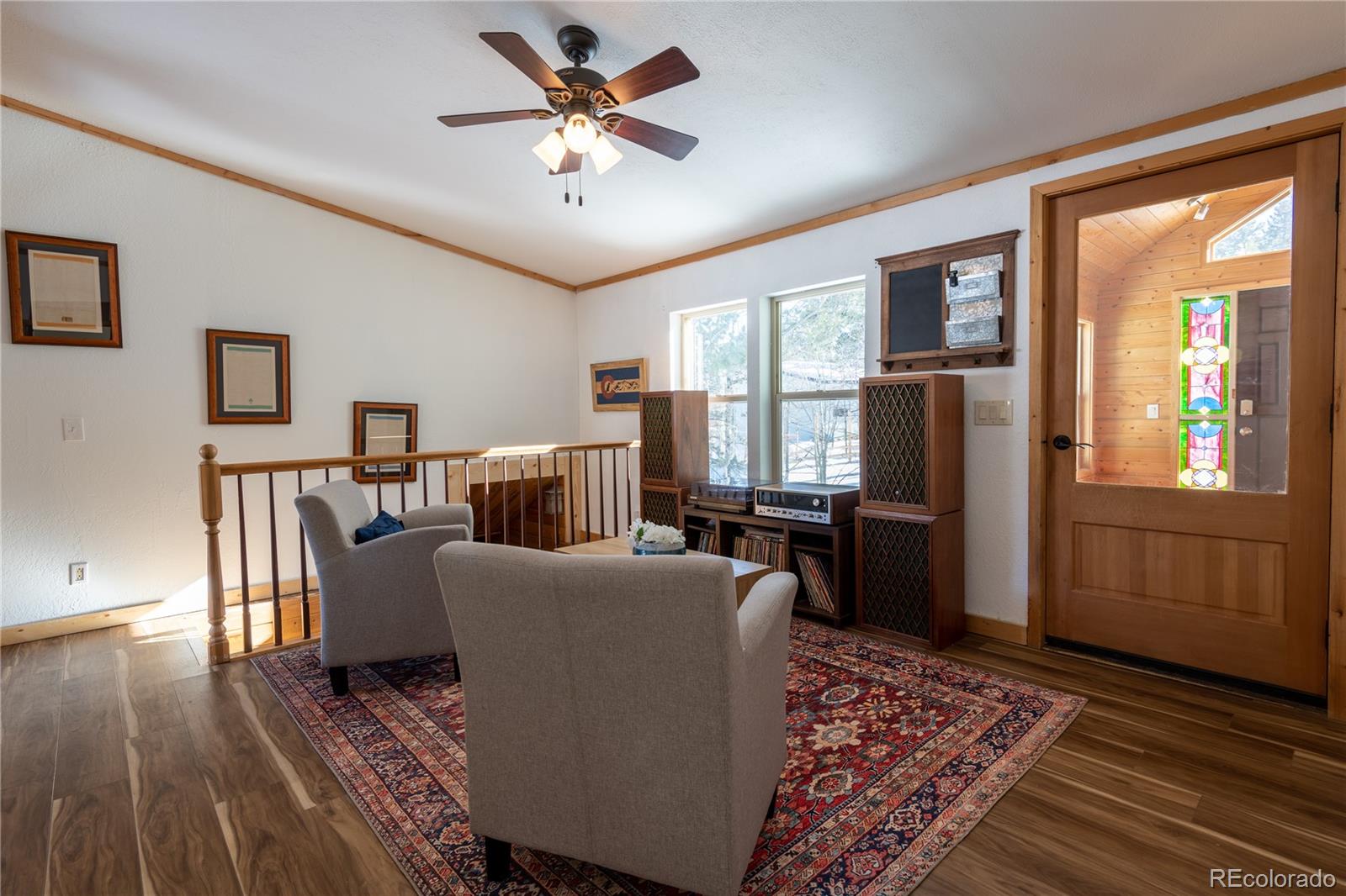 233 Ridge Road Ward, CO 80481 - Photo 5 of 36 a living room with furniture fireplace and a window