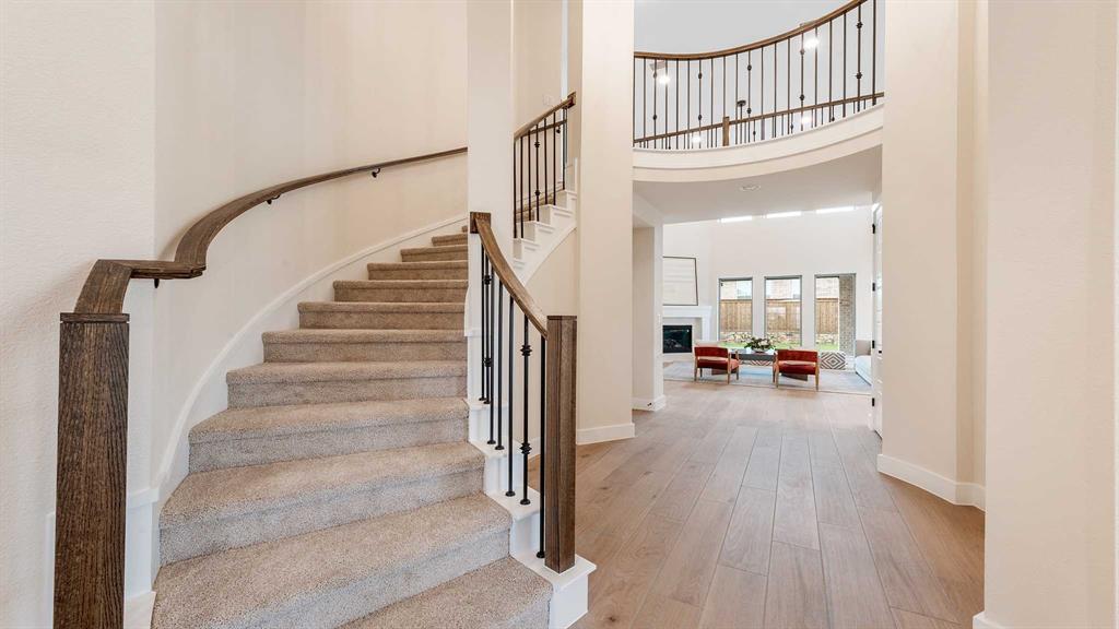 854 Stoney Bridge Way Lavon, TX 75166 - Photo 17 of 36 a view of a livingroom with wooden floor and furniture