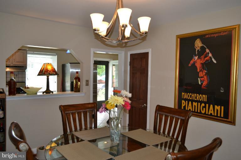 3013 Dunran Road Baltimore, MD 21222 - Photo 1 of 19 a view of a dining room with furniture wooden floor and chandelier