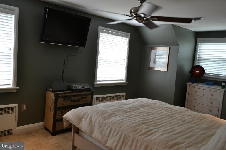 3013 Dunran Road Baltimore, MD 21222 - Photo 2 of 19 a bedroom with a bed and a window
