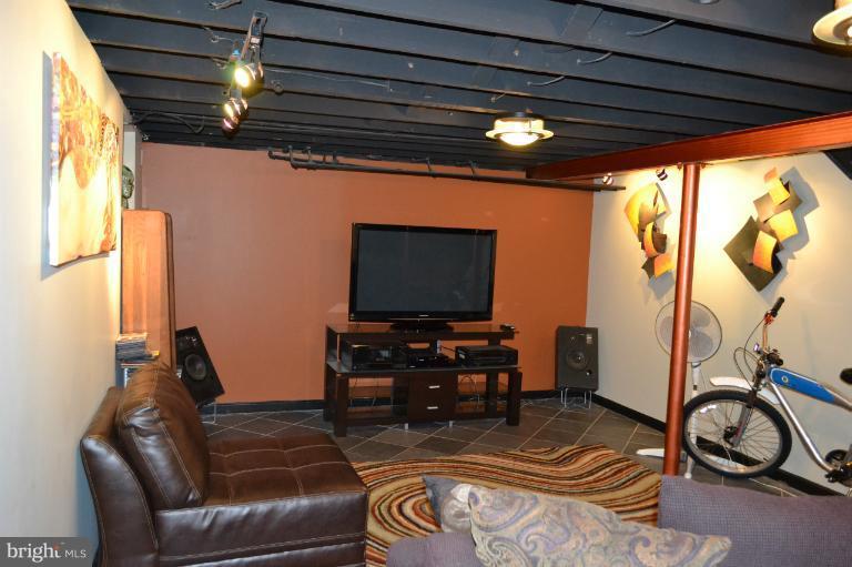 3013 Dunran Road Baltimore, MD 21222 - Photo 14 of 19 a living room with furniture and a flat screen tv