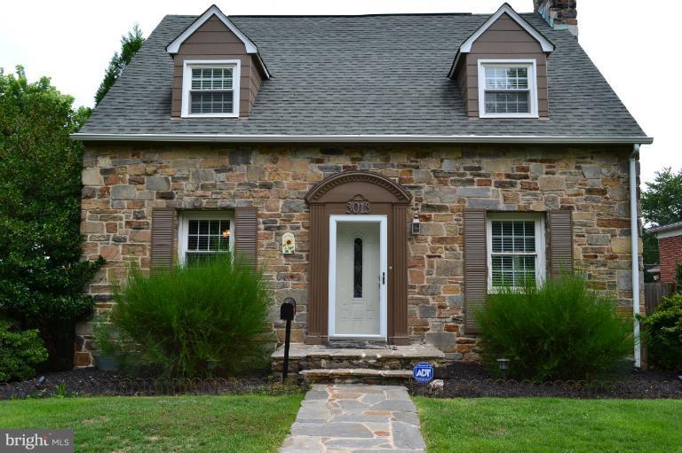 3013 Dunran Road Baltimore, MD 21222 - Photo 16 of 19 a front view of a house with a yard