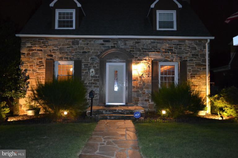 3013 Dunran Road Baltimore, MD 21222 - Photo 18 of 19 a front view of a house with a yard