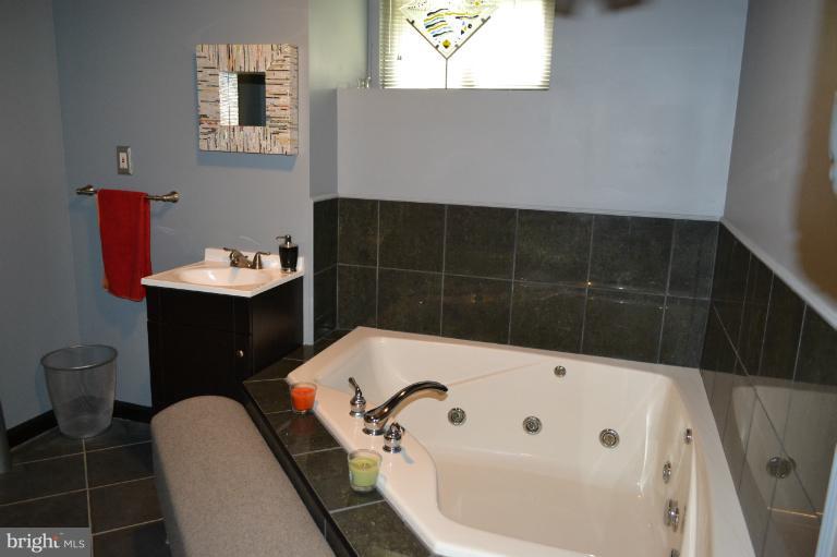 3013 Dunran Road Baltimore, MD 21222 - Photo 19 of 19 a bathroom with a bathtub sink and toilet