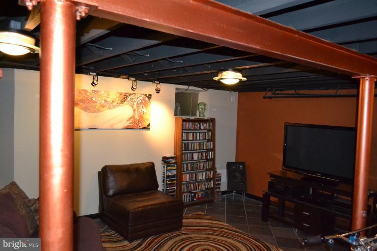 3013 Dunran Road Baltimore, MD 21222 - Photo 3 of 19 a room with furniture and a flat screen tv