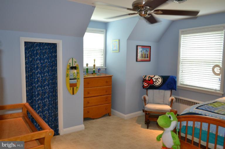 3013 Dunran Road Baltimore, MD 21222 - Photo 8 of 19 a room with furniture a chandelier and a window