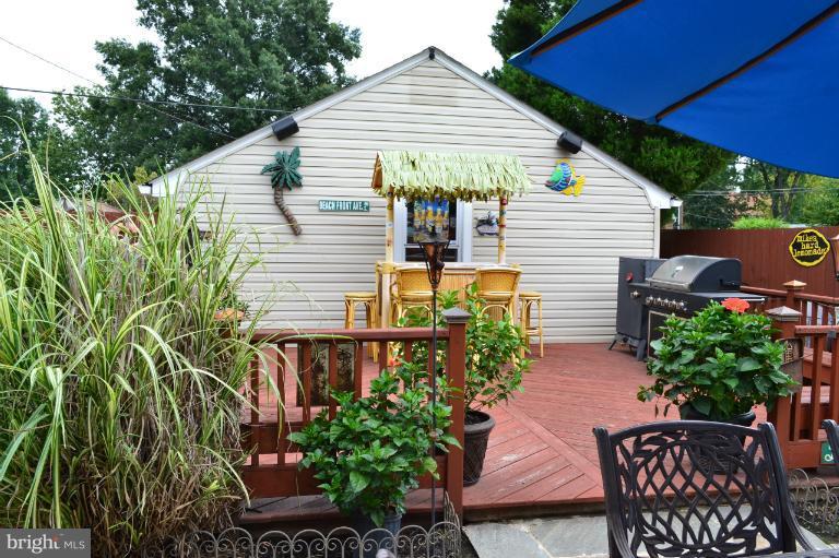 3013 Dunran Road Baltimore, MD 21222 - Photo 9 of 19 a view of a patio with table and chairs and potted plants