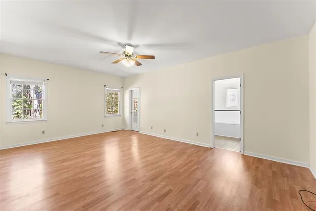 a white bath tub sitting next to a white sink