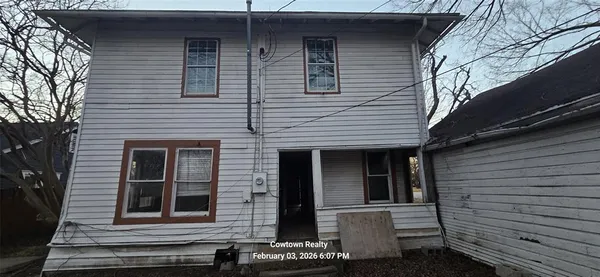 a view of a house with a window and stairs