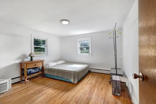 a bedroom with a bed and a table