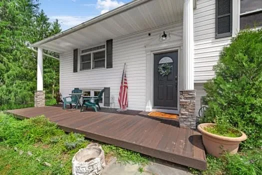 a front view of a house with garden