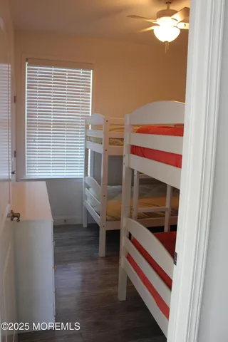 a view of a bedroom with furniture and a window