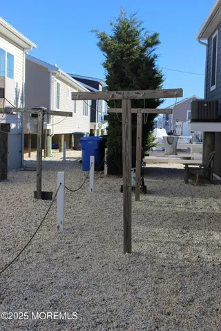 a view of a house with a backyard space and sitting area
