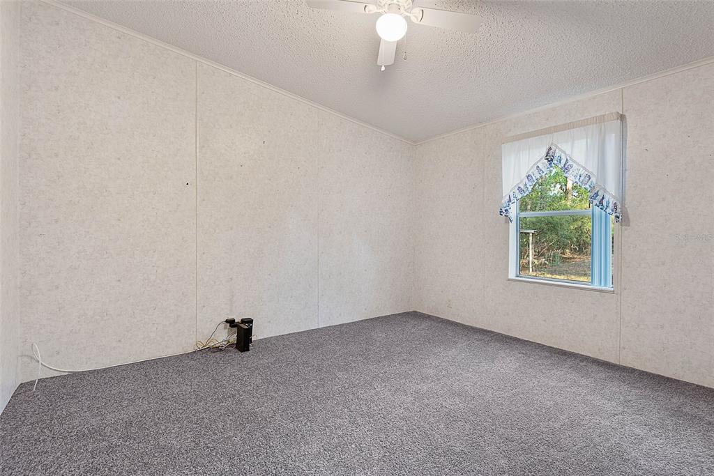 4544 Butternut Avenue Bunnell, FL 32110 - Photo 20 of 42 an empty room with a window