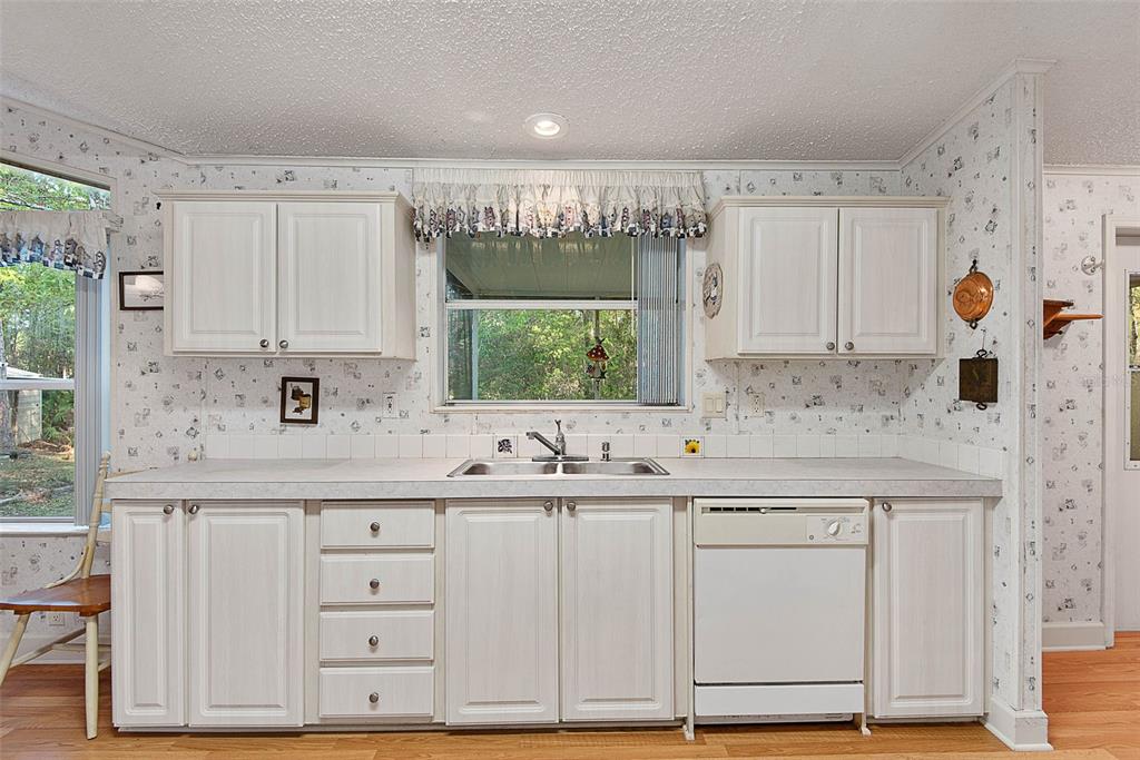 4544 Butternut Avenue Bunnell, FL 32110 - Photo 26 of 42 a kitchen with a sink cabinets and window