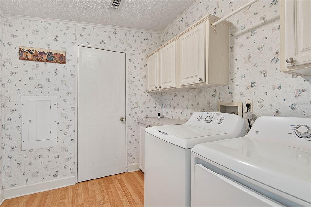 4544 Butternut Avenue Bunnell, FL 32110 - Photo 27 of 42 a utility room with dryer and washer