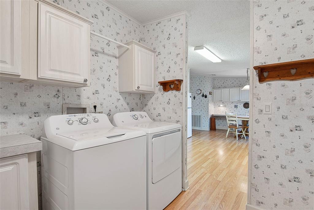 4544 Butternut Avenue Bunnell, FL 32110 - Photo 28 of 42 a utility room with dryer and washer