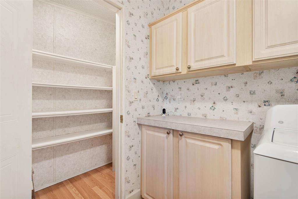 4544 Butternut Avenue Bunnell, FL 32110 - Photo 29 of 42 a view of cabinets with wooden floor