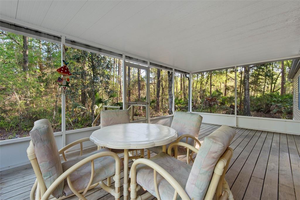 4544 Butternut Avenue Bunnell, FL 32110 - Photo 31 of 42 a view of a dining room with furniture window and outside view