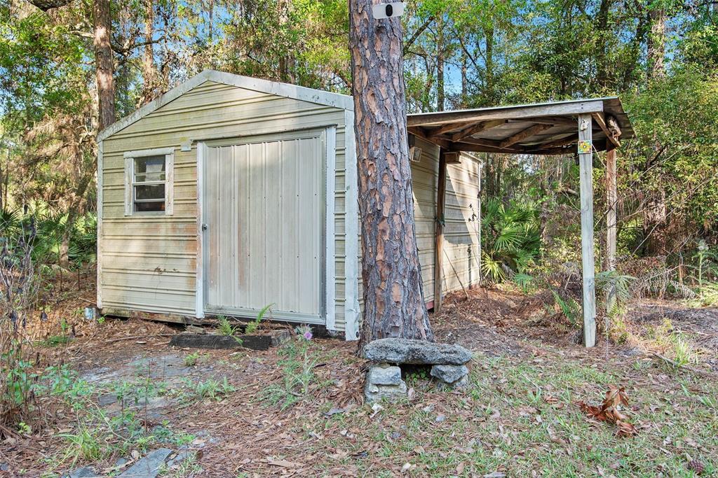 4544 Butternut Avenue Bunnell, FL 32110 - Photo 34 of 42 a front view of a house with garden
