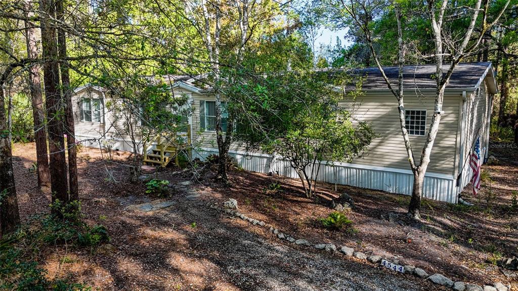 4544 Butternut Avenue Bunnell, FL 32110 - Photo 40 of 42 a backyard of a house with lots of green space