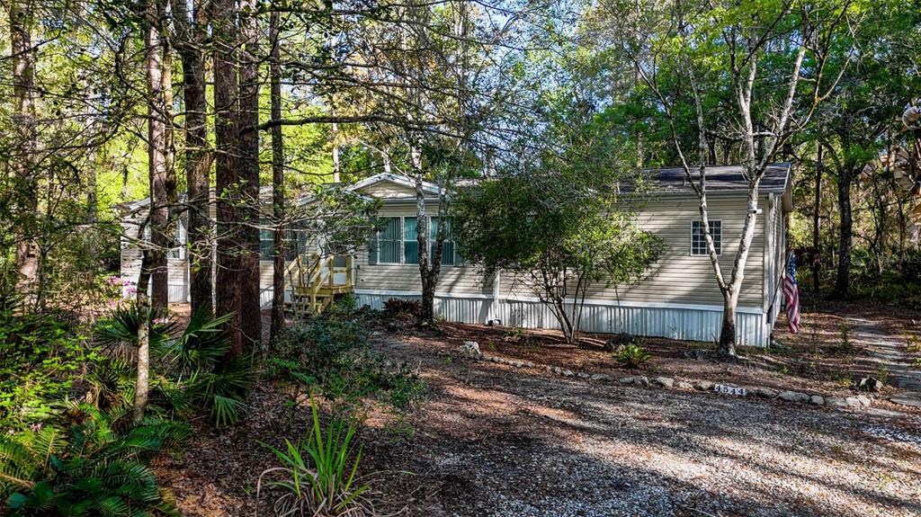 4544 Butternut Avenue Bunnell, FL 32110 - Photo 41 of 42 a backyard of a house with lots of green space