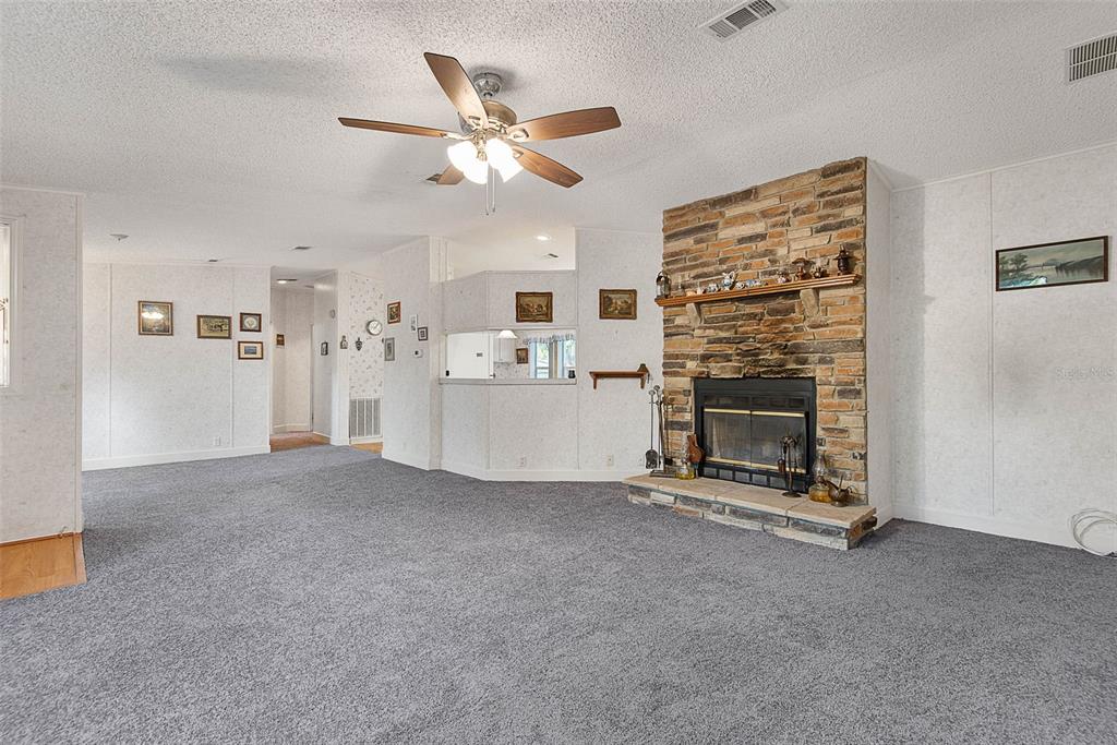 4544 Butternut Avenue Bunnell, FL 32110 - Photo 5 of 42 a view of a livingroom with a fireplace