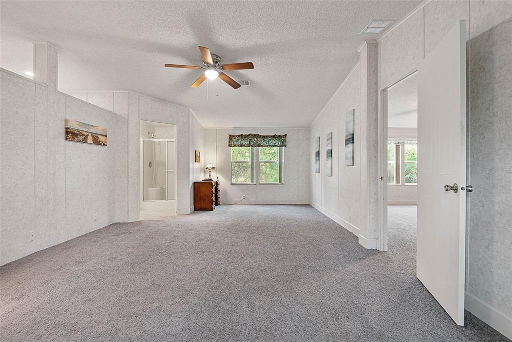 4544 Butternut Avenue Bunnell, FL 32110 - Photo 9 of 42 a view of empty room with window and ceiling fan