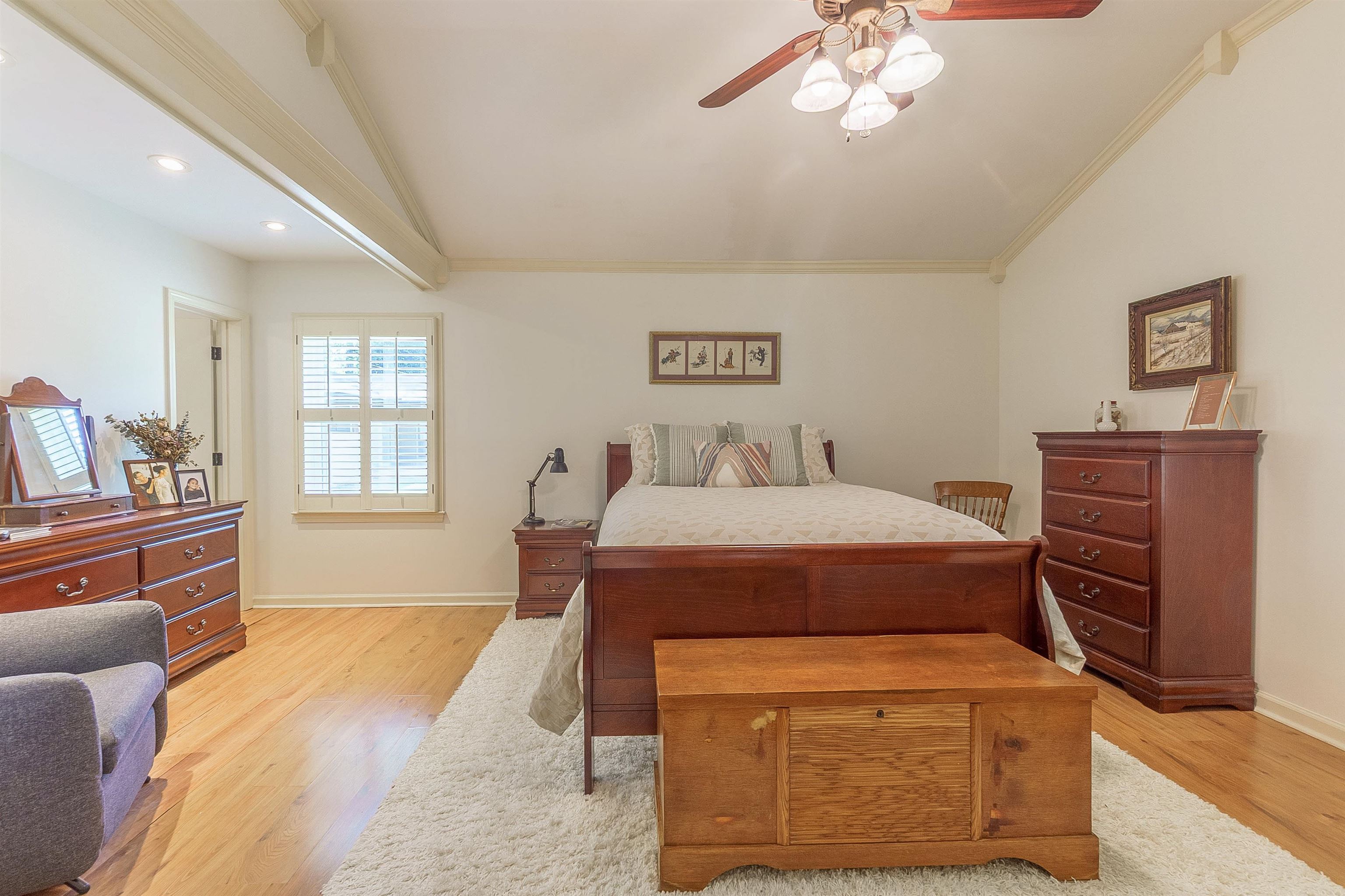 5649 Normandy Road Memphis, TN 38120 - Photo 20 of 35 a bedroom with a bed and wooden floor