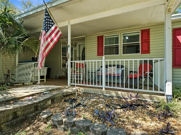 a front view of a house with a fence