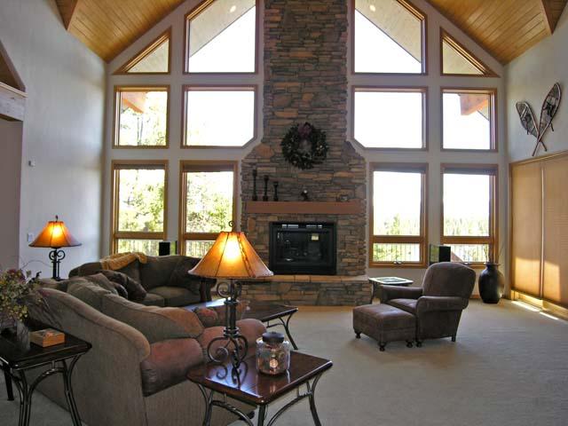 87 Ridge Road Tabernash, CO 80478 - Photo 2 of 13 a living room with furniture fireplace and a large window