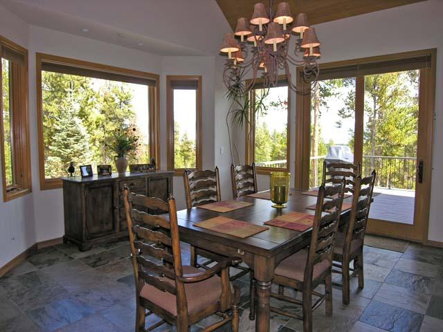 87 Ridge Road Tabernash, CO 80478 - Photo 4 of 13 a view of a dining room with furniture large windows and wooden floor