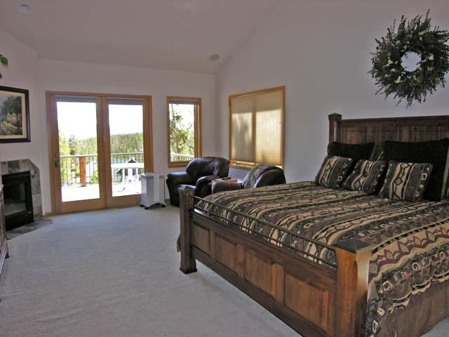87 Ridge Road Tabernash, CO 80478 - Photo 7 of 13 a bedroom with a bed and a couch