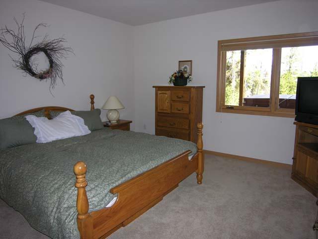 87 Ridge Road Tabernash, CO 80478 - Photo 9 of 13 a bedroom with a bed and a window