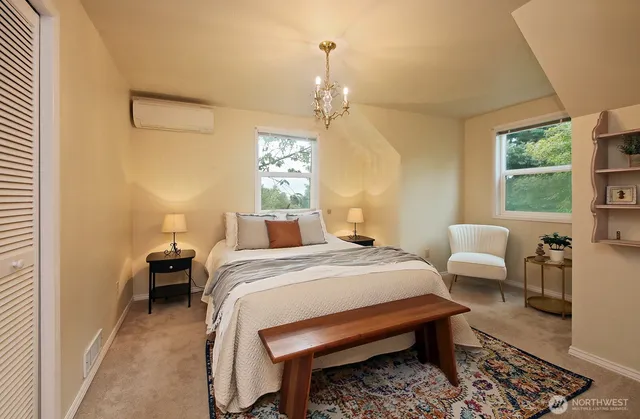 a bedroom with bed and a window