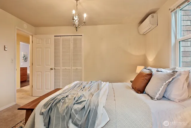 a bedroom with a bed and a window