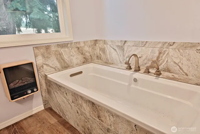 a view of a bath tub sitting in a bathroom