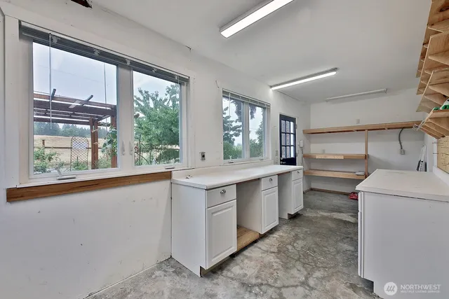 a kitchen with a sink stove and cabinets