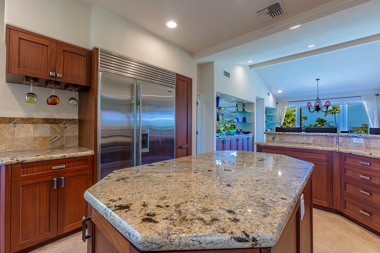 164 West Ikea Moku Place Kihei, HI 96753 - Photo 19 of 49 a kitchen with stainless steel appliances kitchen island granite countertop a table and chairs in it