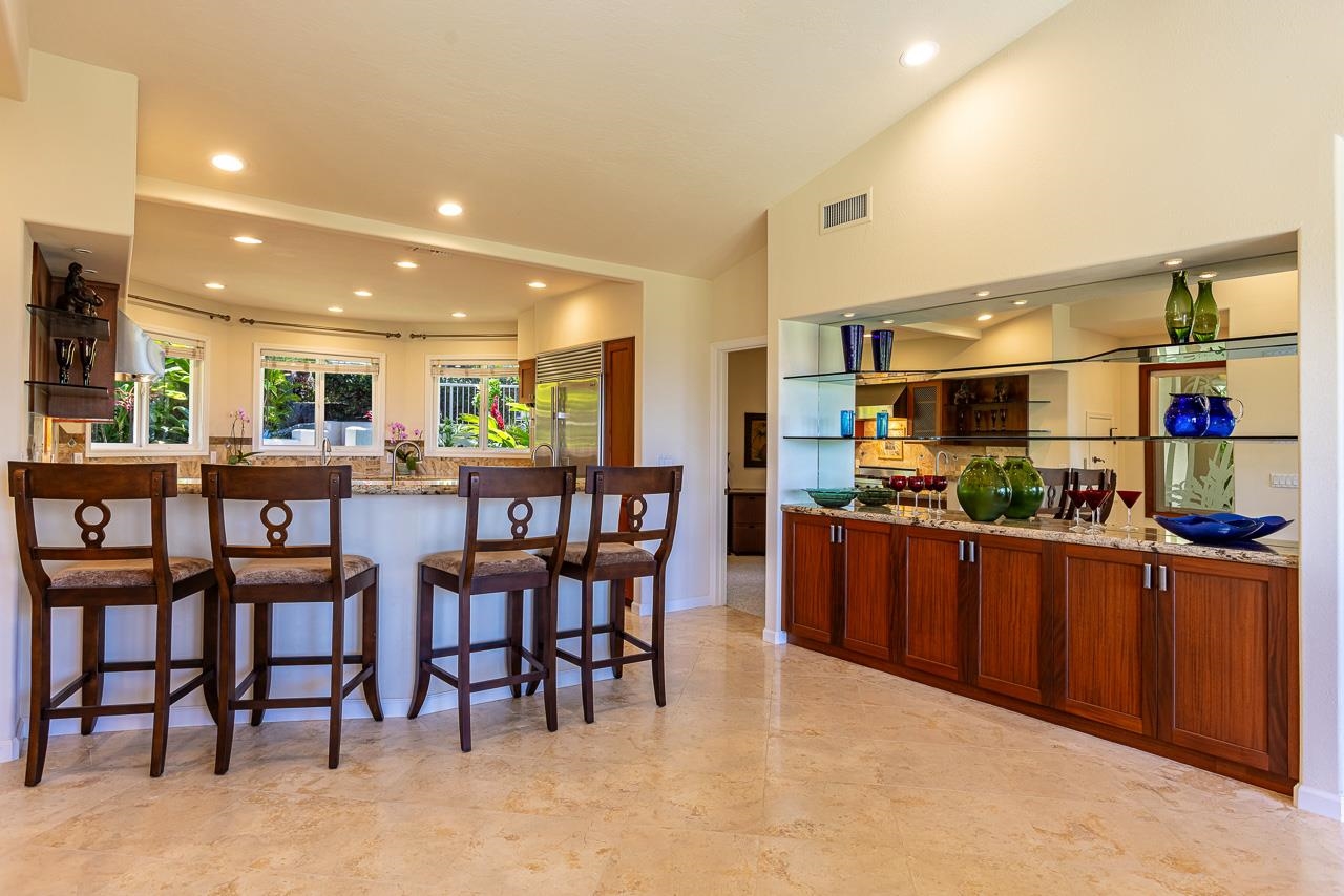 164 West Ikea Moku Place Kihei, HI 96753 - Photo 22 of 49 a kitchen with stainless steel appliances kitchen island granite countertop a table and chairs