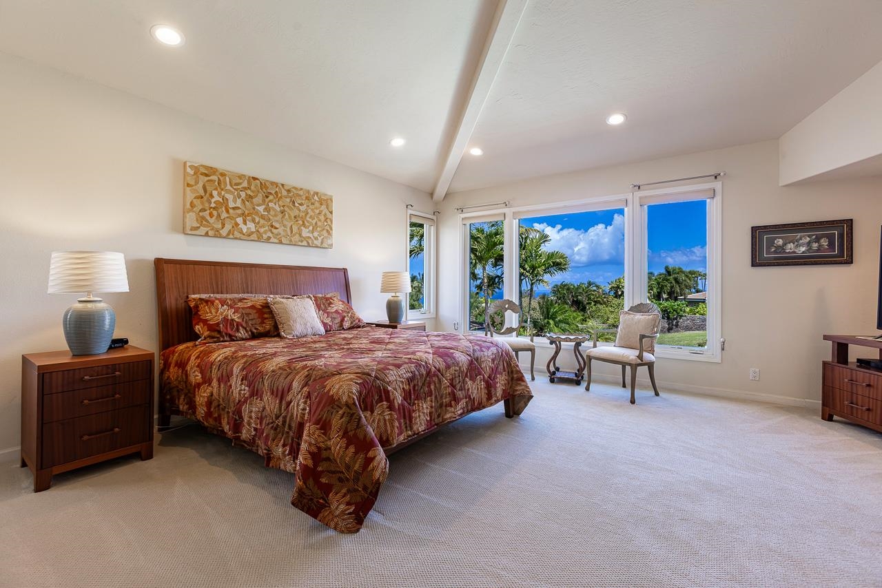 164 West Ikea Moku Place Kihei, HI 96753 - Photo 26 of 49 a spacious bedroom with a bed and a window