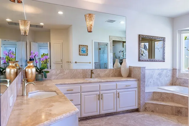 a bathroom with a tub and a sink