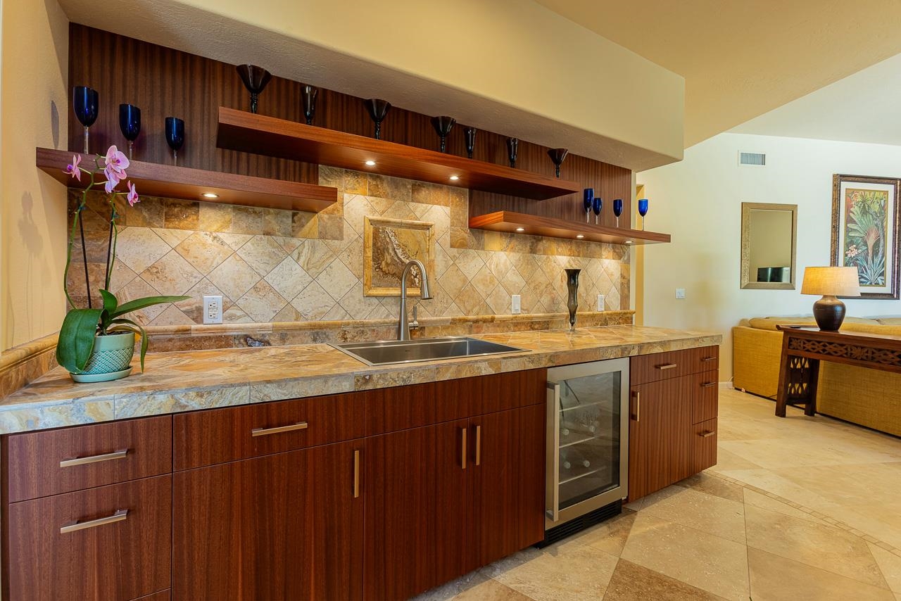 164 West Ikea Moku Place Kihei, HI 96753 - Photo 38 of 49 a spacious bathroom with a granite countertop sink and a mirror