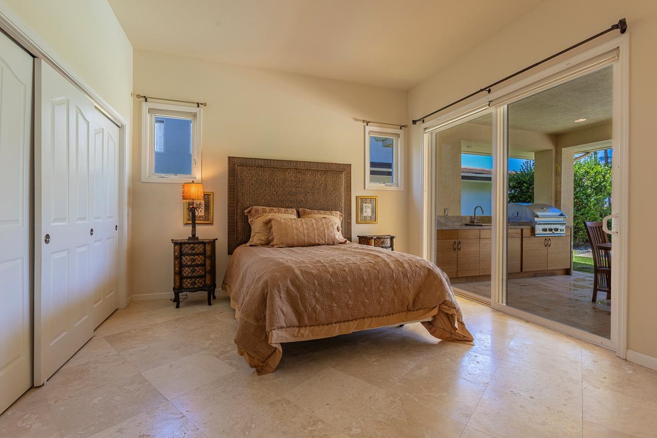 164 West Ikea Moku Place Kihei, HI 96753 - Photo 41 of 49 a bedroom with a large bed and a large window