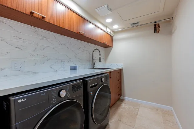 a view of a street with palm trees