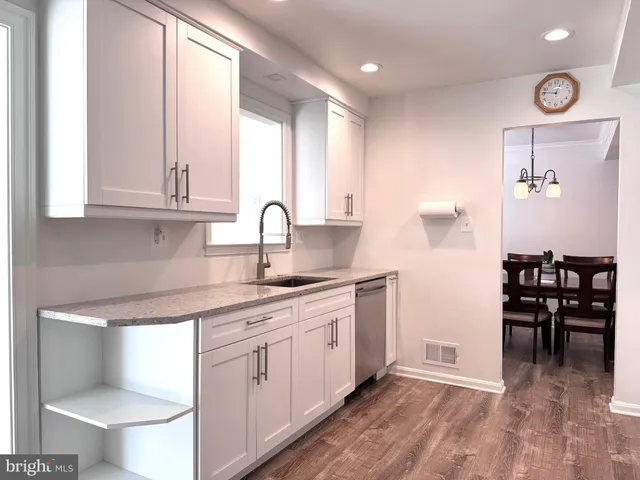 a kitchen with stainless steel appliances a refrigerator stove and microwave